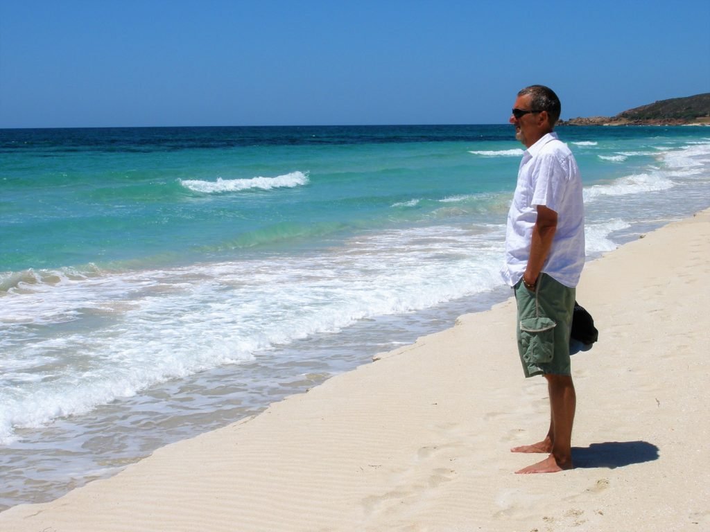 Tropical beach, man standing