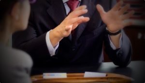 defence lawyer, behind desk